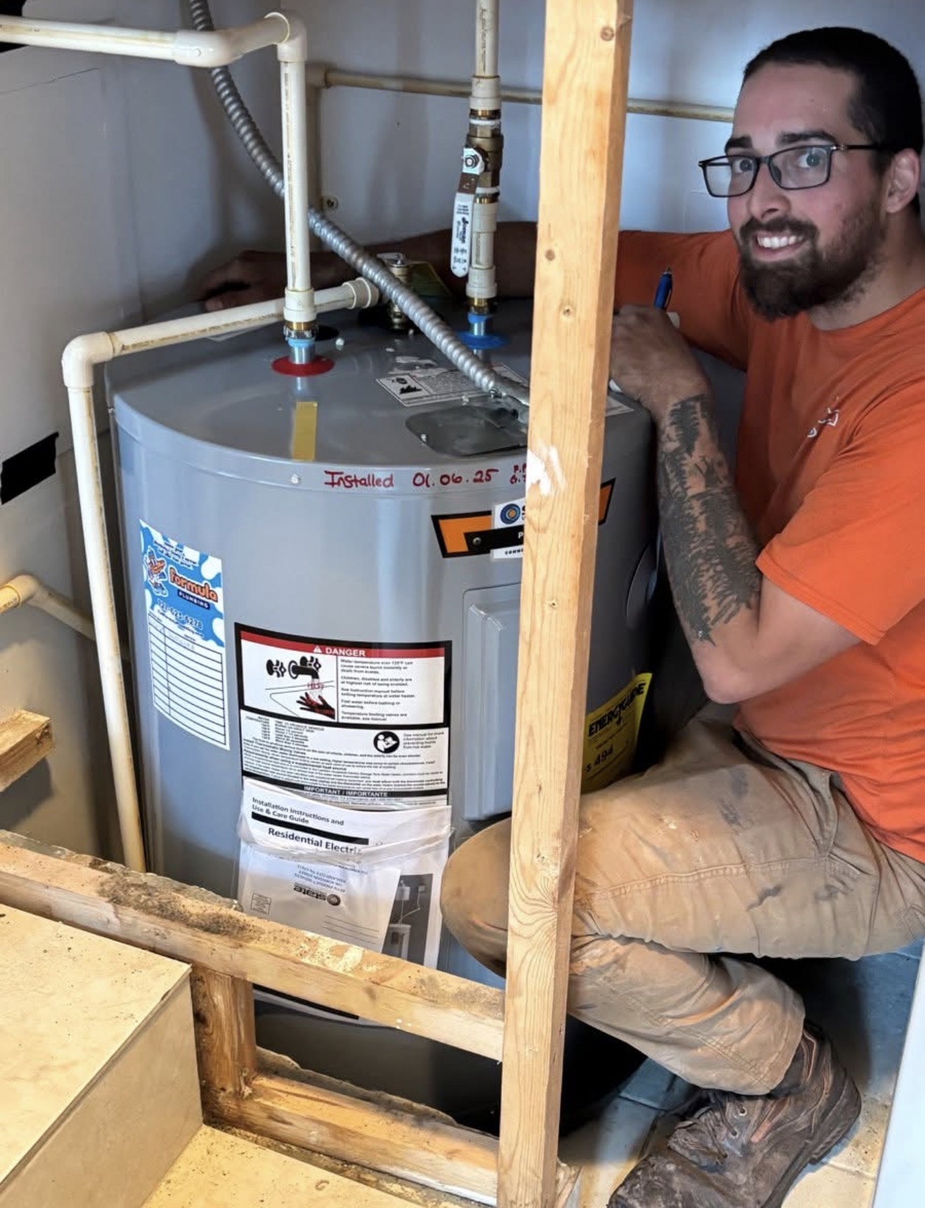 Formula Plumbing technician installing water heater in Tampa Bay home