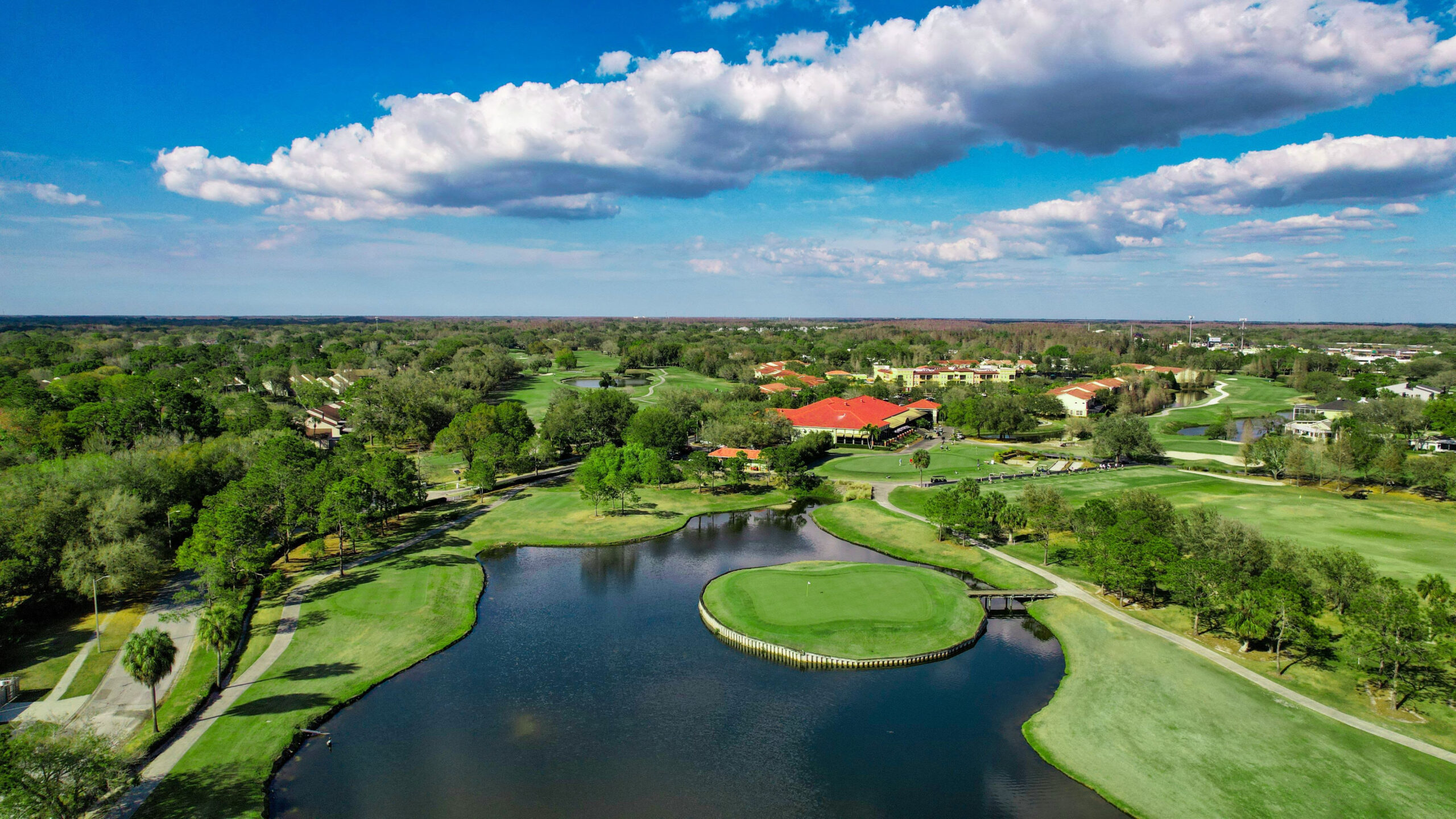 Aerial view of Carrollwood Country Club golf course and lake in Tampa, FL