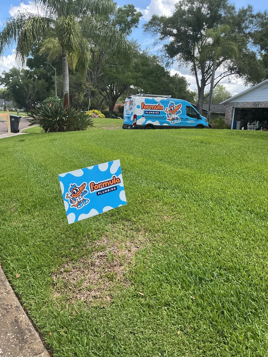 Formula Plumbing service van and yard sign in a Citrus Park, FL neighborhood