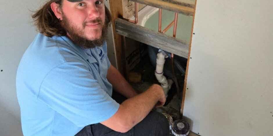 Working on a plumbing emergency Working on a plumbing emergency
